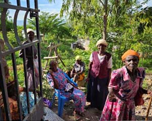 Group of women standing at a gate